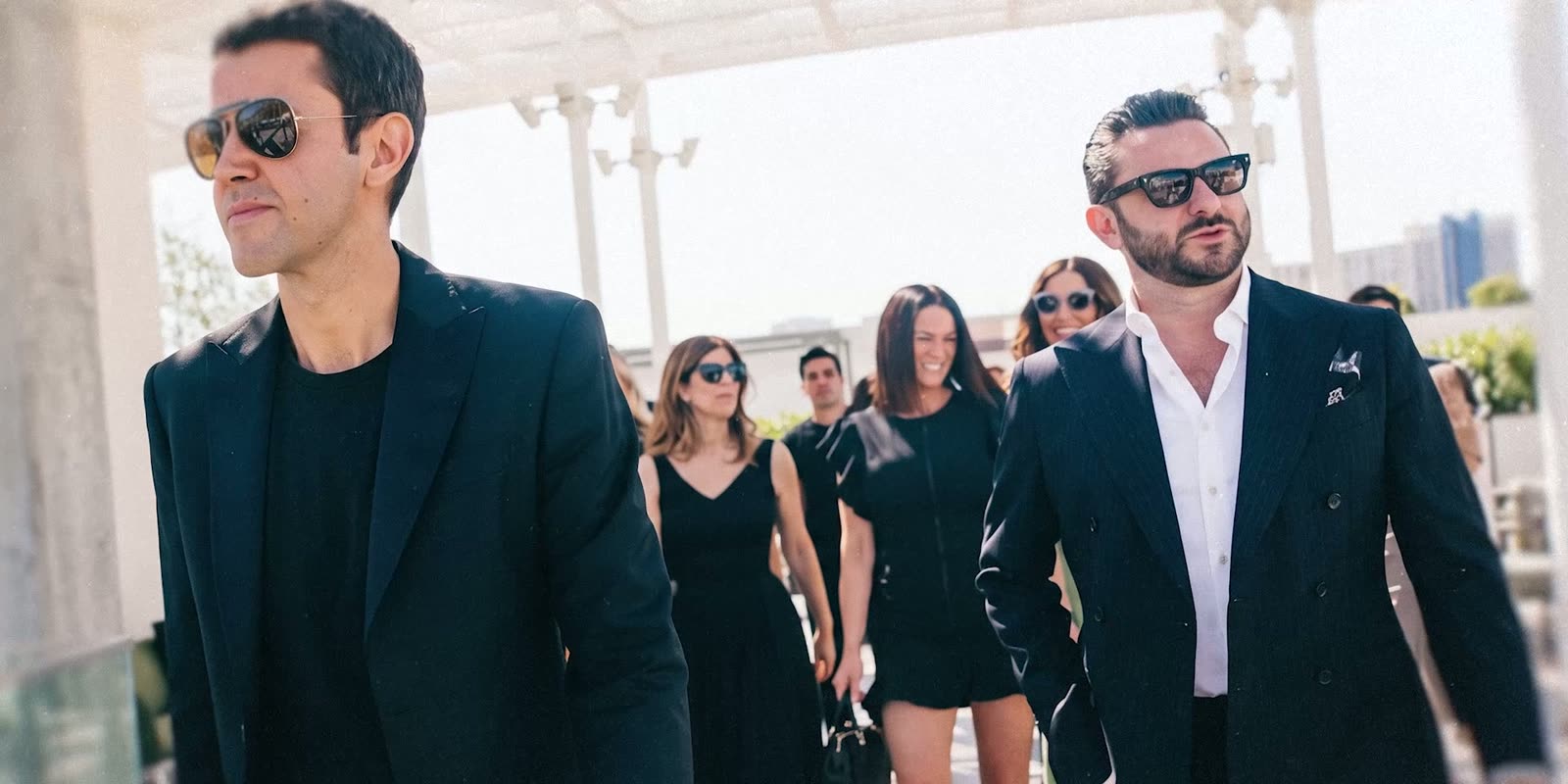 Ari Afshar walking with members of the Voyage team outside a Los Angeles building