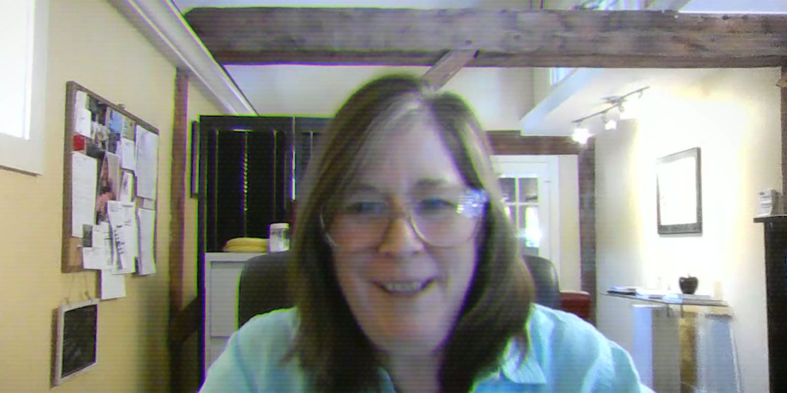 Chrissy Smith smiling in her office during the interview